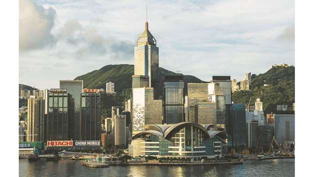 Commercial and residential buildings standing on Hong Kong island are seen from the Tsim Sha Tsui district. Hong Kongu2019s long recession showed signs of easing in the third quarter, with a gradual improvement in domestic and external demand from an improving Chinese economy, an easing of the Covid-19 outbreak and stronger financial market activity.