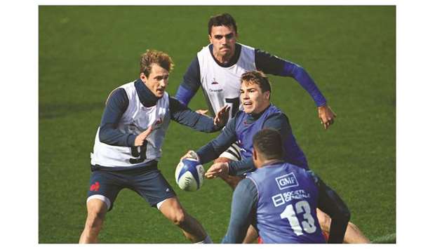 Franceu2019s scrum halves Antoine Dupont (R) and Baptiste Serin (L) take part in a training session in Marcoussis, southern Paris, ahead of the Six Nations rugby union match against Ireland.