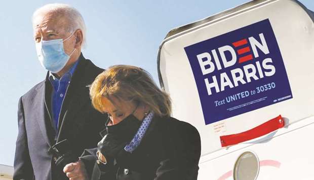 Democratic US presidential nominee and former vice president Joe Biden, accompanied by his sister Valerie, arrives at the airport to campaign in Des Moines, Iowa, yesterday.