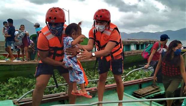 Personnel from the coast guard evacuating residents from the coastal villages of Buhi town, Camarines Sur province, south of Manila, to a safer place, ahead of Typhoon Goni's landfall. AFP/PHILIPPINE COAST GUARD