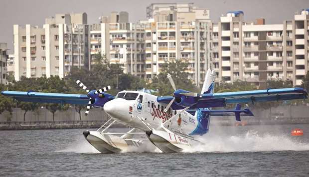 A seaplane, operated by SpiceJetu2019s Spice Shuttle, lands in the waters of Sabarmati river after it was inaugurated by Prime Minister Narendra Modi yesterday.