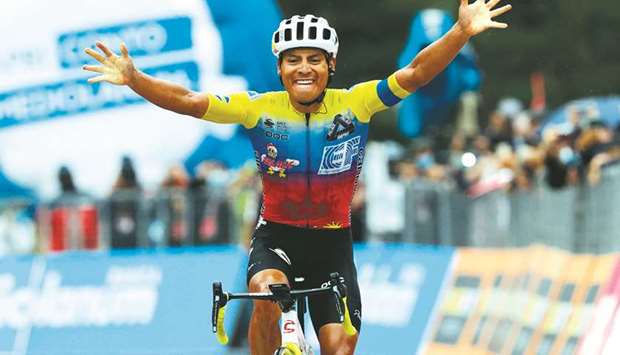 Team Education First rider Jonathan Caicedo of Ecuador celebrates as he crosses the finish line to win the third stage of the Giro du2019Italia, a 150-kilometre route between Enna and volcano Etna, Linguaglossa-Piano Provenzana, Sicily, yesterday. (AFP)