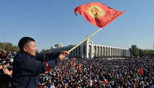 People protest against the results of a parliamentary vote in Bishkek.