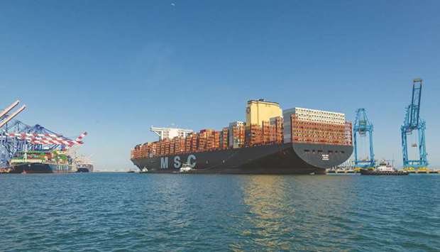 Tugboats guiding a container ship arriving at the Port of Los Angeles. The overall gap in trade in goods and services in the US expanded to $67.1bn in August from a revised $63.4bn in July, according to Commerce Department data released yesterday.