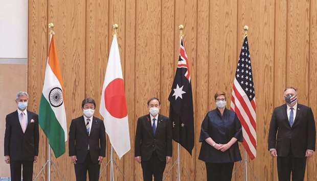 (From left) Indiau2019s Foreign Minister Subrahmanyam Jaishankar, Japanu2019s Foreign Minister Toshimitsu Motegi, Japanu2019s Prime Minister Yoshihide Suga, Australiau2019s Foreign Minister Marise Payne and US Secretary of State Mike Pompeo posing for photographs before a Quad Indo-Pacific meeting at the prime ministeru2019s office in Tokyo, yesterday.