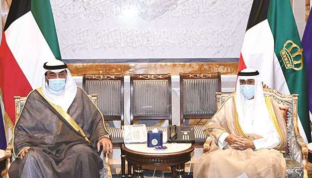 Kuwaitu2019s Amir Sheikh Nawaf al-Ahmad al-Jaber al-Sabah meets with Prime Minister Sheikh Sabah al-Khalid al-Sabah, in Kuwait City, yesterday.