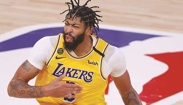 Anthony Davis of the Los Angeles Lakers reacts to a three-point basket against the Miami Heat in Game Four of the 2020 NBA Finals at AdventHealth Arena in Lake Buena Vista, Florida.