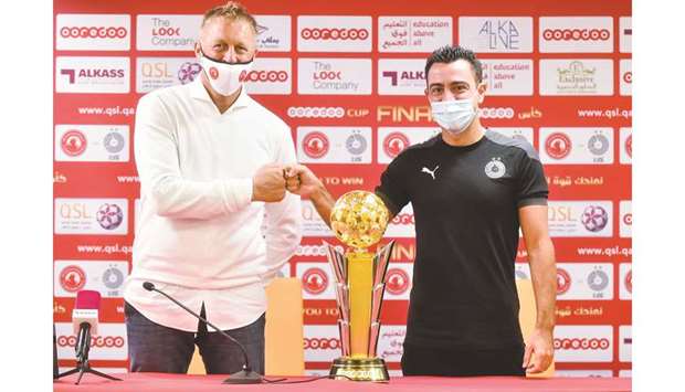 Al Arabi coach Heimir Hallgrimsson (left) and Al Sadd coach Xavi Hernandez during the press conference ahead of the Ooredoo Cup final on Wednesday. PICTURE: Noushad Thekkayil