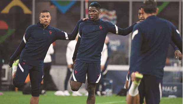 Franceu2019s Kylian Mbappe (left) and Paul Pogba during a training session at San Siro in Milan, Italy, yesterday. (Reuters)
