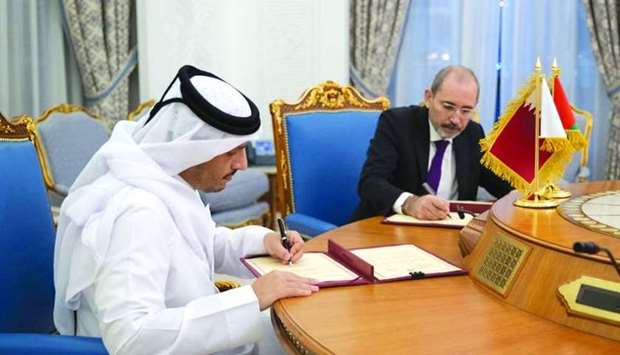 HE the Deputy Prime Minister and Minister of Foreign Affairs Sheikh Mohamed bin Abdulrahman al-Thani and Jordan's Deputy Prime Minister and Minister of Foreign Affairs and Expatriates Ayman al-Safadi sign the agreement