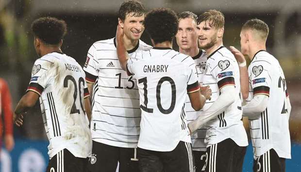 Germanyu2019s forward Timo Werner (second right) celebrates with teammates after scoring his teamu2019s second goal during the FIFA World Cup Qatar 2022 qualification Group J match against North Macedonia at the Toshe Proeski National Arena in Skopje on Monday night. (AFP)