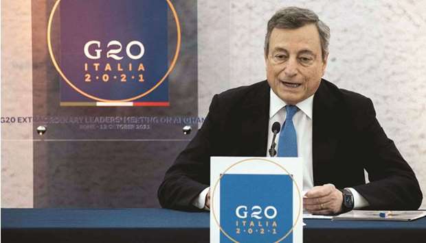 Italian Prime Minister Mario Draghi speaks during a press conference following a G20 virtual summit focused on Afghanistan in Rome yesterday. (AFP)