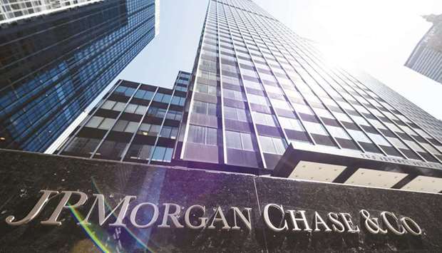 The JPMorgan Chase & Co headquarters in New York City. JPMorgan reported higher third-quarter profits yesterday, as the improving economic outlook allowed it to include in earnings $2.1bn set aside earlier in the pandemic for potential loan defaults.