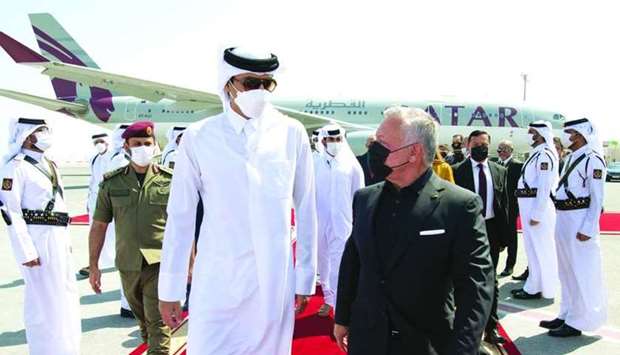 His Highness the Amir leads well-wishers to see off the King of Jordan