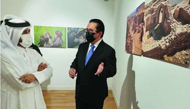 Kazakhstan ambassador Arman Issagaliyev briefs Prof Khalid Ibrahim al-Sulaiti about the images on display at Katara-the Cultural Village. PICTURE: Joey Aguilar