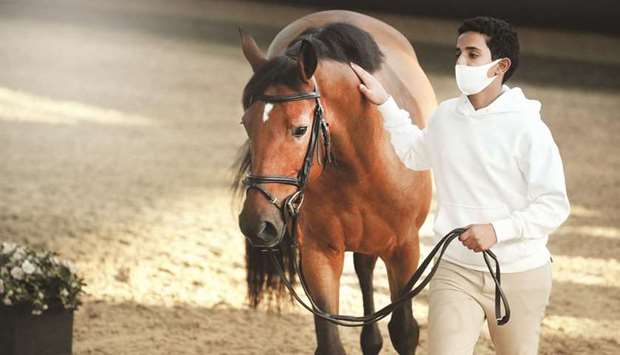Rider with his horse during the vet check ahead of the new season of the Qatar Equestrian Tour Longines Hathab at the Qatar Equestrian Federation.