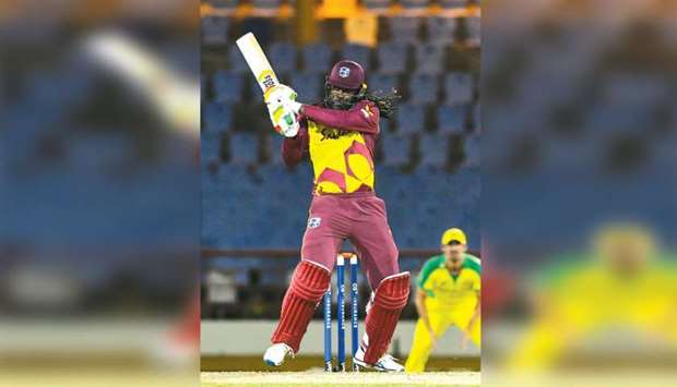 This file photo taken on July 12, 2021, shows Chris Gayle of West Indies hitting a boundary during the 3rd T20I against Australia at Darren Sammy Cricket Ground in Gros Islet, Saint Lucia. (AFP)
