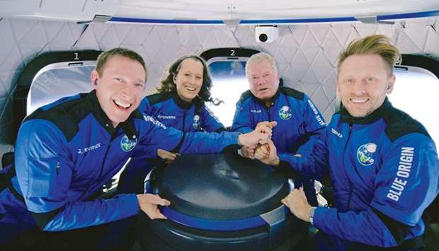 Star Trek actor William Shatner poses with other participants of the Blue Origin New Shepard mission NS-18 suborbital flight near Van Horn, Texas (see report below).