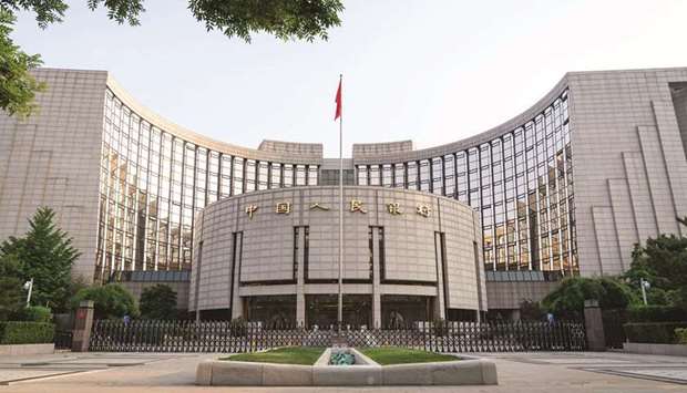 The Peopleu2019s Bank of China headquarters building in Beijing. Chinau2019s central bank broke its silence on the debt crisis at China  Evergrande, saying risks to the financial system stemming from the developeru2019s struggles are u201ccontrollableu201d and unlikely to spread.