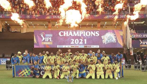 CSK players and officials celebrate with the IPL trophy after beating KKR in the final in Dubai yesterday. (Sportzpics for IPL)
