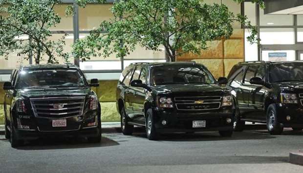The motorcade of former US President Bill Clinton wait at the University of California Irvine Douglas Hospital, after Clinton was admitted to the UCI Medical Center, in Orange, California