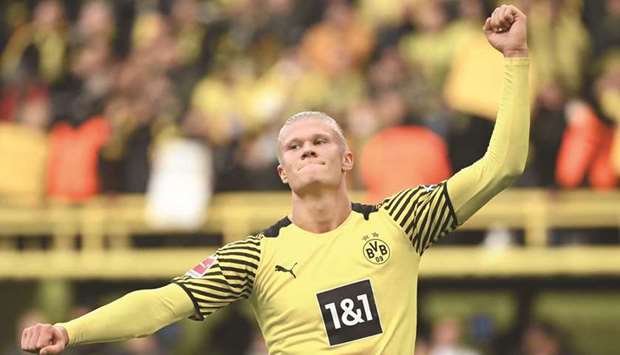 Dortmundu2019s Norwegian forward Erling Braut Haaland celebrates after scoring against Mainz 05 in Dortmund yesterday. (AFP)