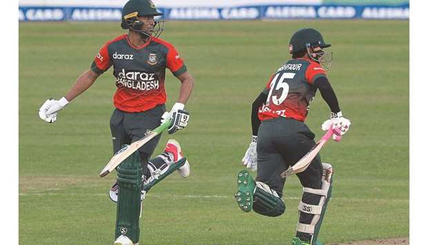 In this file photo taken on September 1, 2021, Bangladeshu2019s Mushfiqur Rahim (right) and Shakib Al Hasan run between the wickets during the first Twenty20 international match against New Zealand in Dhaka. (AFP)