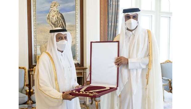 His Highness the Amir Sheikh Tamim bin Hamad Al-Thani awards the Hamad Bin Khalifa Sash to HE the former Speaker of the Shura Council Ahmad bin Abdullah bin Zaid Al Mahmoud