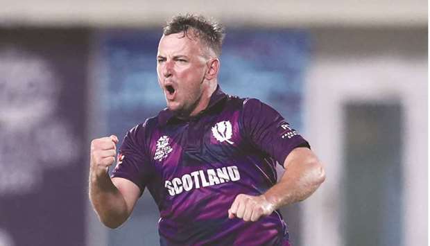 Scotlandu2019s Chris Greaves celebrates after taking the wicket of Bangladeshu2019s Mushfiqur Rahim during the ICC Twenty20 World Cup match at the Oman Cricket Academy Ground in Muscat yesterday. (AFP)
