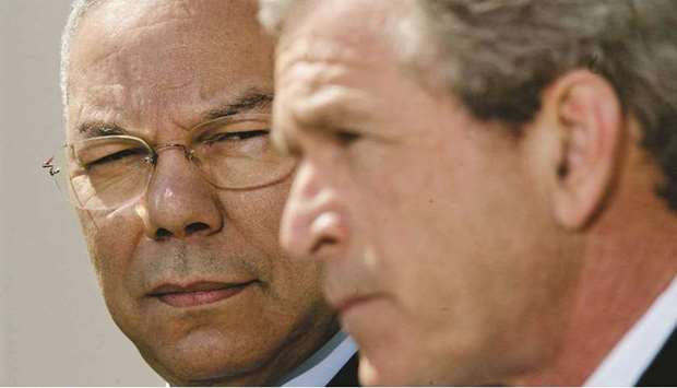 'RELUCTANT' PARTNER: US secretary of state Colin Powell (left) looks at president George W Bush speak from the Rose Garden of the White House in this April 4, 2002 file photo. (Reuters)
