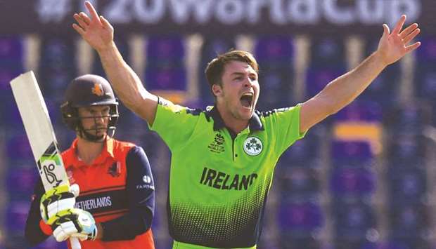 Irelandu2019s Curtis Campher celebrates after taking the wicket of Netherlandsu2019s Scott Edwards during the ICC Twenty20 World Cup match in Abu Dhabi yesterday. (AFP)