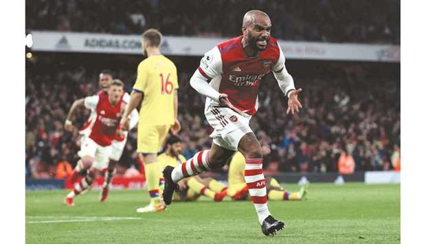 Arsenalu2019s Alexandre Lacazette celebrates after scoring against Crystal Palace during the Premier League match in London on Monday night. (Reuters)