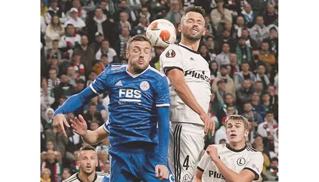 Leicester Cityu2019s English striker Jamie Vardy (left) vies for the ball with Legia Warszawau2019s Polish defender Mateusz Wieteska during the UEFA Europa League Group C match in Warsaw. (AFP)