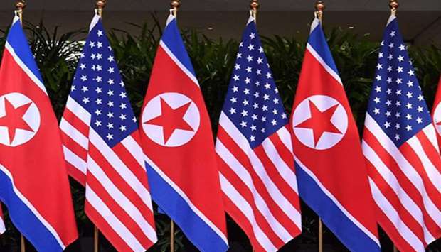 (File photo) Flags of USA and North Korea.