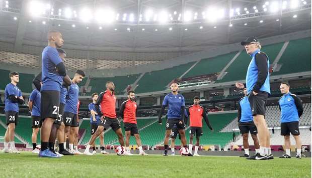Al Rayyan coach Laurent Blanc (right) looks on as his players train at the Al Thumama stadium.