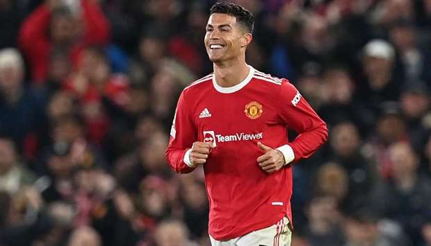 Cristiano Ronaldo celebrates scoring his team's third goal during the UEFA Champions league group F football match between Manchester United and Atalanta at Old Trafford stadium in Manchester, north west England, on October 20, 2021.