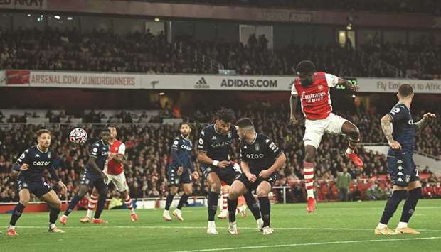 Arsenalu2019s Thomas Partey (second right) scores against Aston Villa during the Premier League match in London yesterday. (AFP)