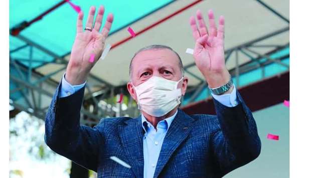 Erdogan greets his supporters in Eskisehir, Turkey, Saturday.