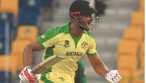 Australiau2019s Marcus Stoinis celebrates after scoring the winning runs during the ICC menu2019s Twenty20 World Cup match against South Africa at the Sheikh Zayed Cricket Stadium in  Abu Dhabi yesterday. (AFP)