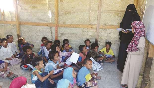 Displaced Yemeni students attend a class at a makeshift school in the Khokha area of the war-torn western province of Hodeidah.