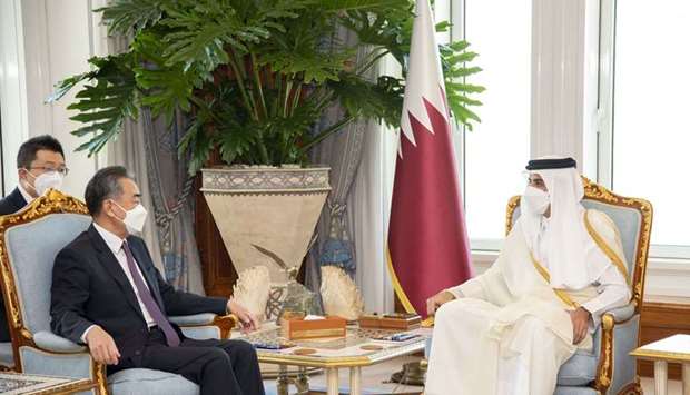 His Highness the Amir Sheikh Tamim bin Hamad Al-Thani meets with the State Councilor and Foreign Minister of China Wang Yi