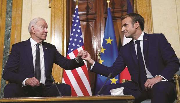 US President Joe Biden meets with French President Emmanuel Macron ahead of the G20 summit in Rome, Italy, yesterday.