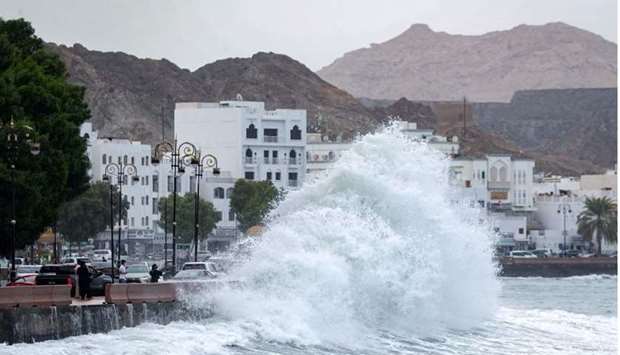 High waves break on the Mutrah sea side promenade in the Omani capital Muscat yesterday, as the Shaheen tropical storm hits the country.  AFP
