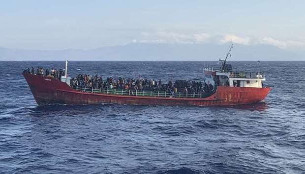 A ship carrying migrants during a rescue operation seen off the island of Crete. Handout/Hellenic Coast Guard/AFP