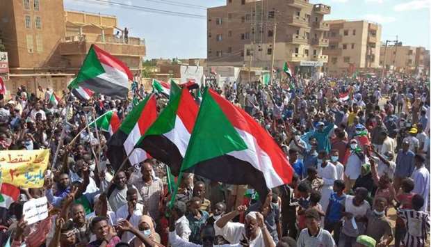 Sudanese anti-coup protesters attend a gathering in the capital Khartoum's twin city of Omdurman yesterday. AFP