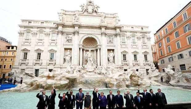 G20 leaders toss a coin into Rome's iconic Trevi Fountain on the sidelines of the G20 summit in Rome, Italy. REUTERS