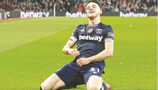 West Ham Unitedu2019s Declan Rice celebrates after scoring against Aston Villa during the Premier League match in Birmingham, central England, yesterday. (AFP)