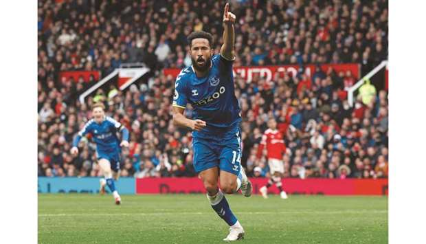 Evertonu2019s Andros Townsend celebrates scoring their first goal against Manchester United at the Old Trafford in Manchester yesterday. (Reuters)