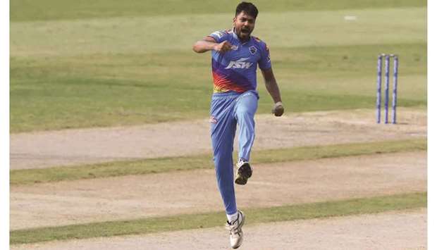 Delhi Capitals Avesh Khan celebrates after taking the wicket of Mumbai Indiansu2019 Hardik Pandya in the Indian Premier League match in Sharjah yesterday. (Sportzpics for IPL)