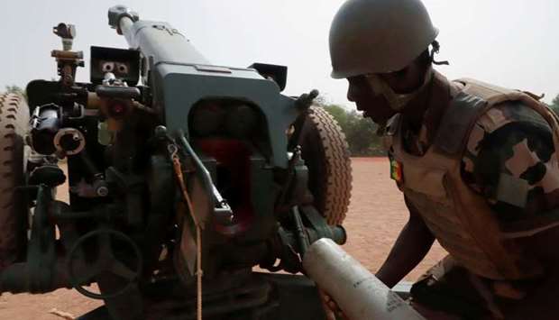 A Malian soldier of the 614th Artillery Battery is pictured during a training session on a D-30 howitzer with the European Union Training Mission (EUTM), to fight militnts, in the camp of Sevare, Mopti region, in Mali March 23. REUTERS